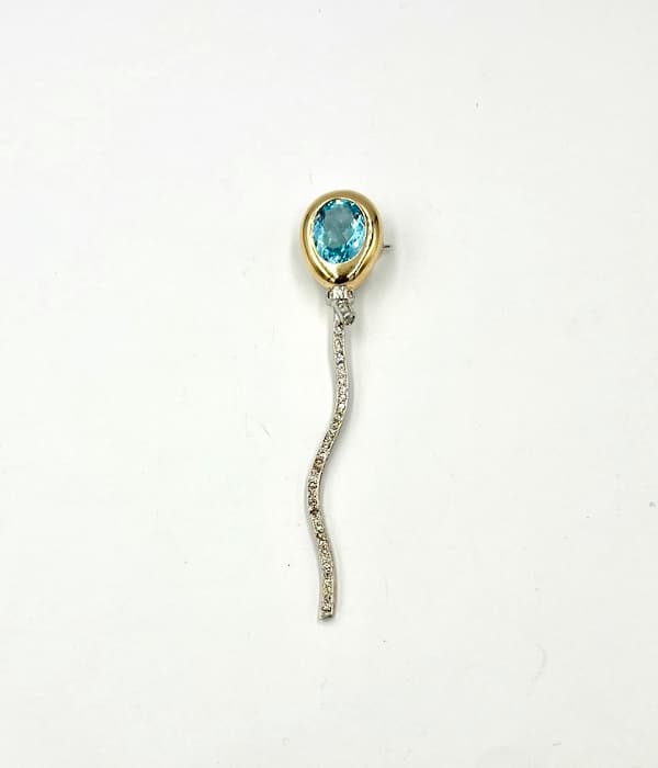 Broche topacio globo